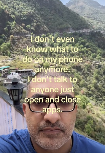 Selfie of a person outside with yellow text caption “ I don't even know what to do on my phone anymore.
I don't talk to anyone just open and close apps.”