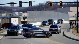 'Hate will never prevail.' Residents confront group displaying swastika flags near I-75