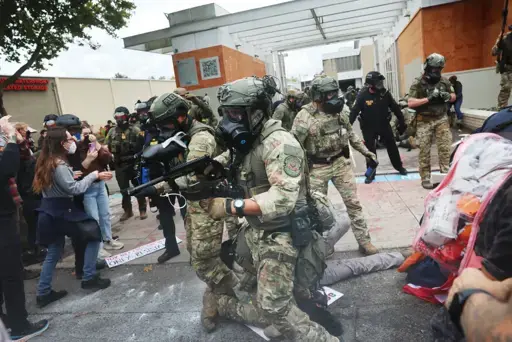 Trump’s Immigration Forces Deploy “Less Lethal” Weapons in Dangerous Ways, Skirting Rules and Maiming Protesters