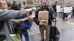 USAID workers pay mournful final visit to agency to clear out their belongings under federal guard