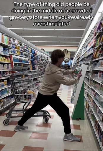 Photo of a person blocking a store aisle with their body and their shopping cart with the caption “The type of thing old people be doing in the middle of a crowded grocery store when you're already overstimulated”