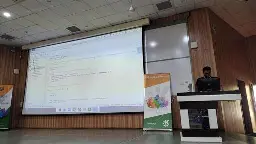 Speaker showing code on how to measure energy efficiency