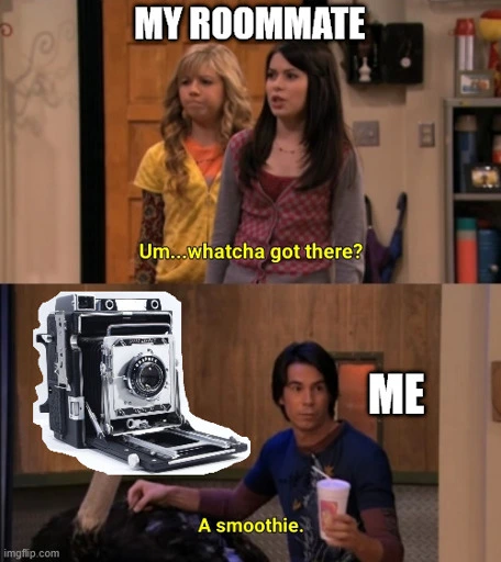 The "whatcha got there" meme, over the heads of the 2 angry people it says "My Roommate", over the other person with a smoothie it says "me", over the ostrich's face there is an attached image of a Graflex Speed Graphic 4x5 camera.