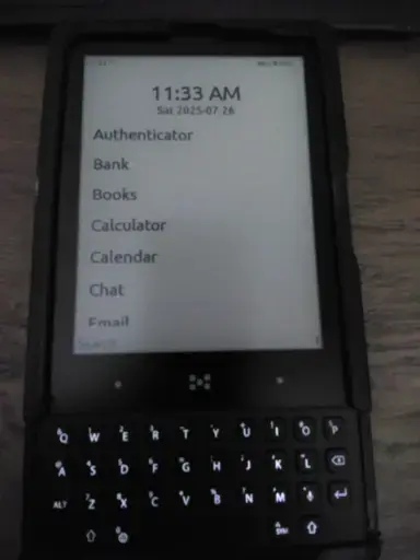 Minimal Phone displaying the home screen and in a slightly crappy 3D printed case.