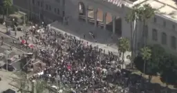 Demonstrators gather at Los Angeles City Hall for immigration policy protest