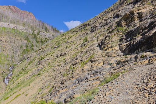 A view of the trail leading towards the falls, there was a bit of a washout on the right here.  Avion ridge looming under mostly blue sky on the top left.