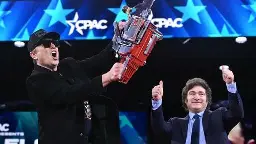 Elon Musk Given "Chainsaw For Bureaucracy" By Javier Milei At CPAC