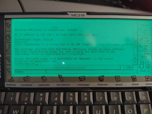 A psion 5mx with a linux terminal output on screen